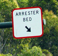 A billboard displaying the ambiguous phrase, Arrester Bed