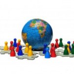 Game figures, representing people, stand around a toy globe