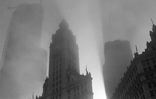 A foggy blacklit cityscape in black and white