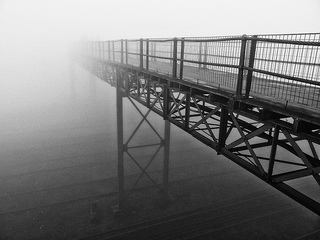 Bridge leading into the fog