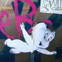 Casper stencil on graffiti wall - by Divine Harvester