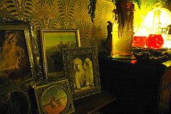 An art nouveau sideboard with picture frames