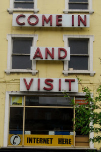 Old shop with 'Come in and visit' signage on front