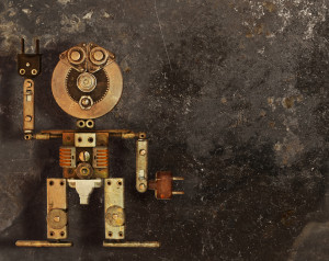 Robot of the metal parts on a dark grungy background