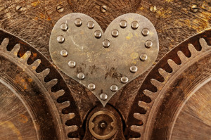 Grungy background with a metallic heart and rivets