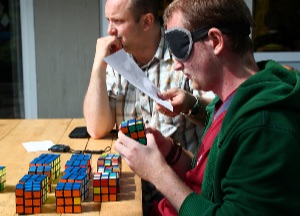 Former world record holder Kai Jiptner, trying to solve 16 Rubik's cubes blindfolded (this would have been world record at the time). Unfortunately, he did not quite make it.