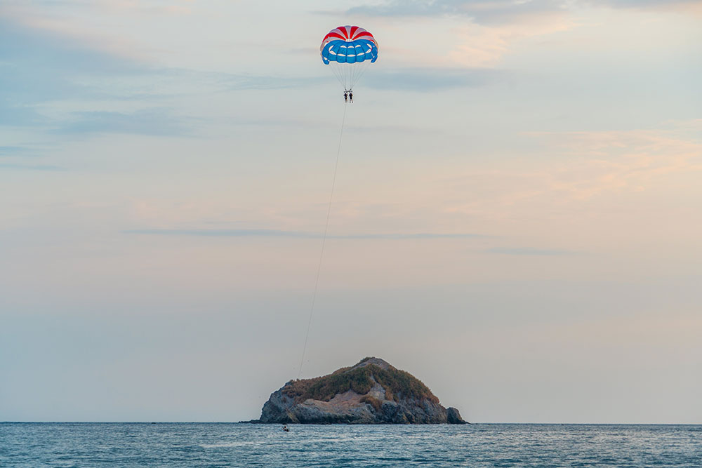 Two people parasailing