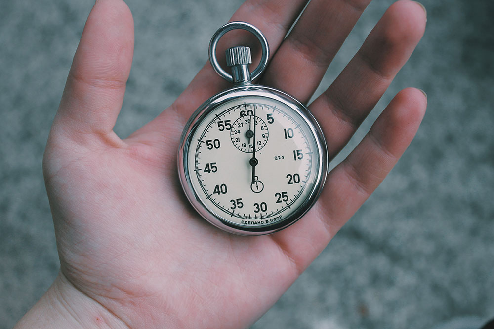 A person holding a pocketwatch