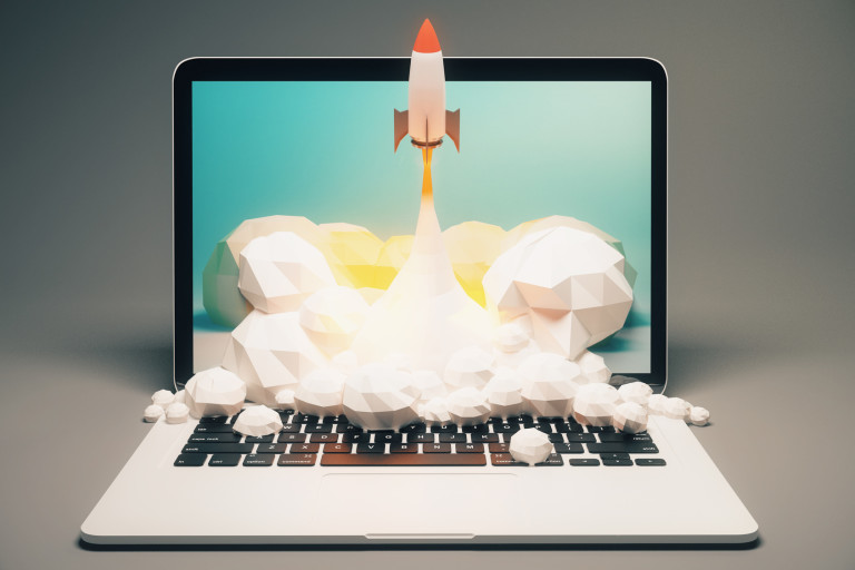 Rocket flying out of laptop screen on grey background