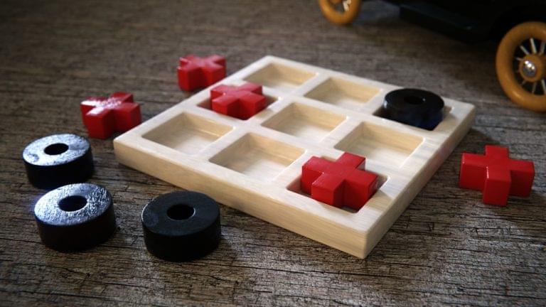 Wooden game of tic-tac-toe