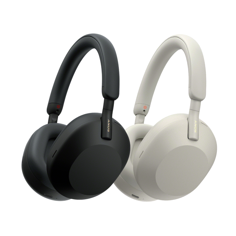 Two pair of headphones, one white, and one black